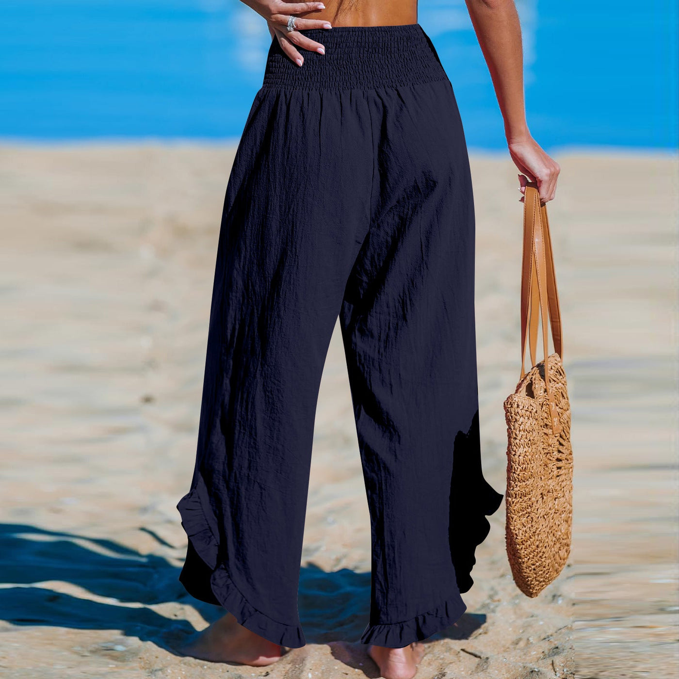 Isoldea – Smocked Ruffle Hem Trousers